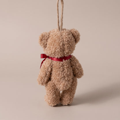Teddy bear marrón con lazo rojo