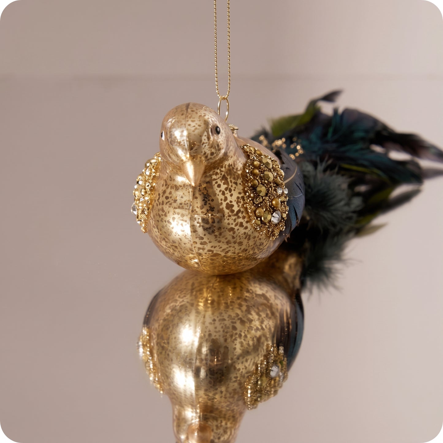 Cola de pluma de pájaro de cristal dorada