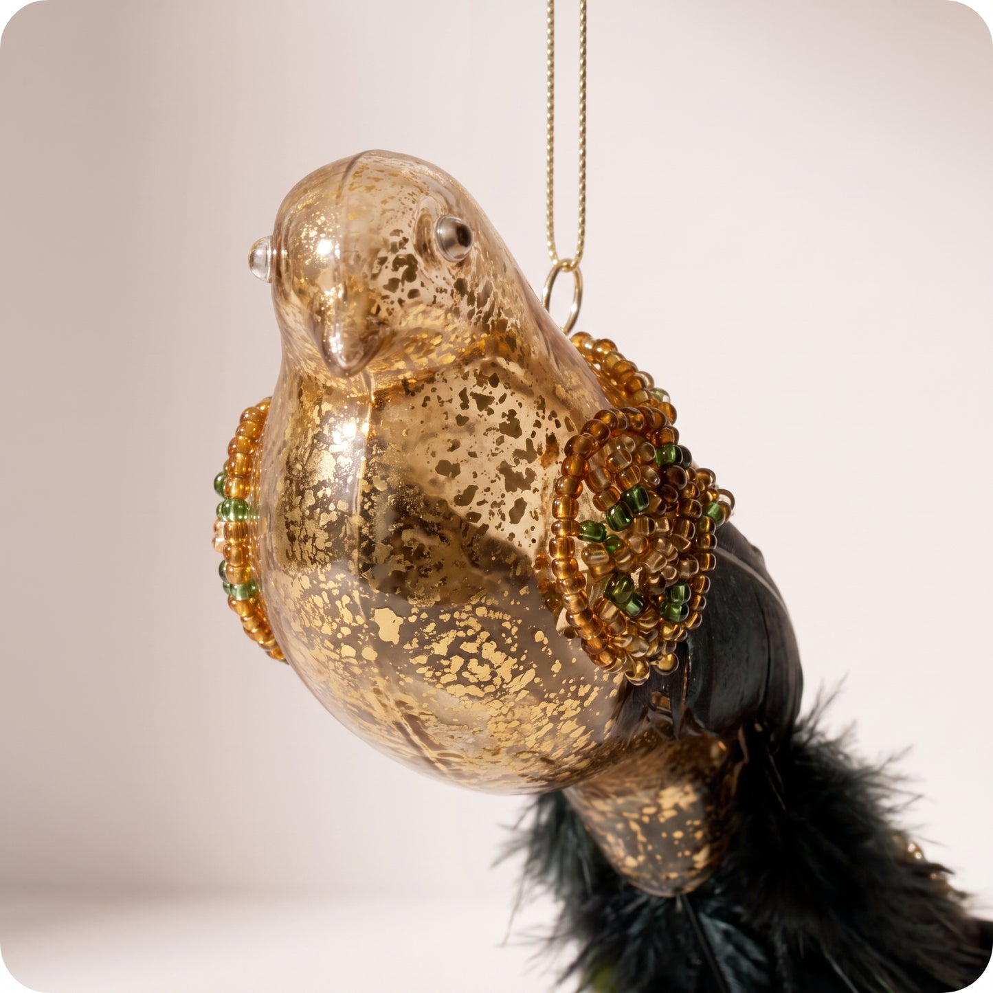 Cola de pluma de pájaro de cristal dorada