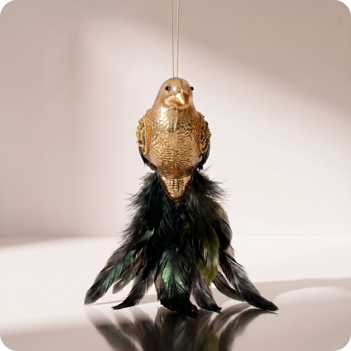 Cola de pluma de pájaro de cristal dorada
