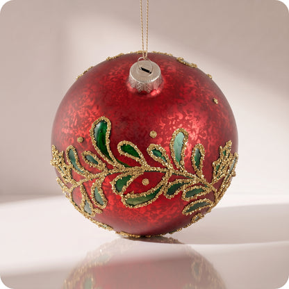 Esfera de cristal rojo con hojas verdes y brillos dorados 12 cm