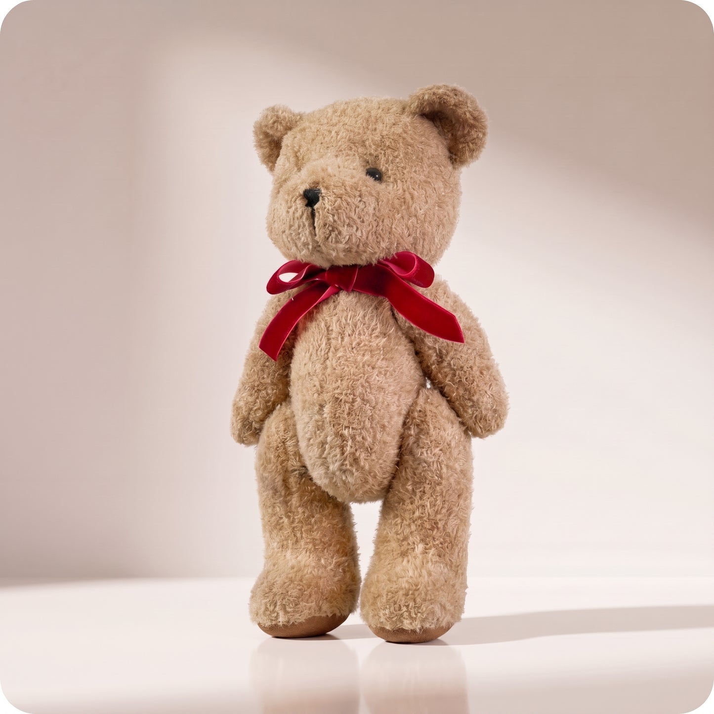 Teddy bear marrón con lazo rojo grande
