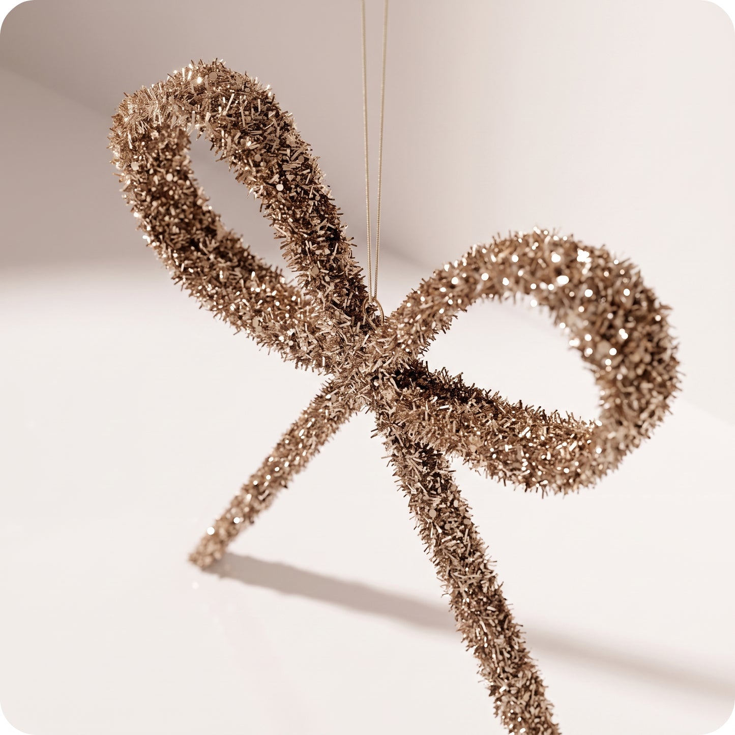 Esfera moño largo champagne con brillos rigido 35 y 25 cm