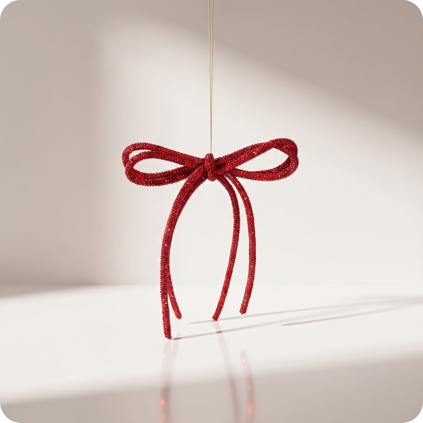 Moño de listón rojo con brillos