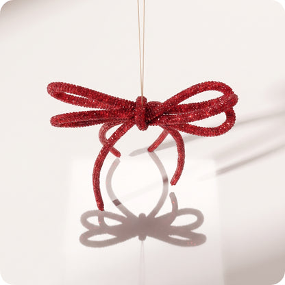 Moño de listón rojo con brillos