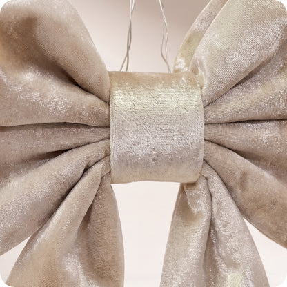 Moño con relleno elegante de terciopelo brillante champagne