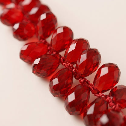 Guirnalda de piedras acrílicas roja