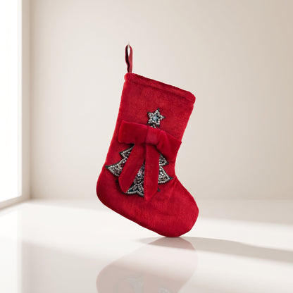 Bota de terciopelo con árbol y lazo rojo