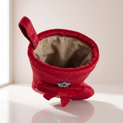 Bota de terciopelo con árbol y lazo rojo