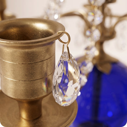Candelabro chapado en níquel con esfera de cristal azul dorado