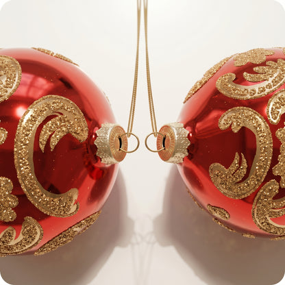 Esfera de vidrio roja con piedras doradas