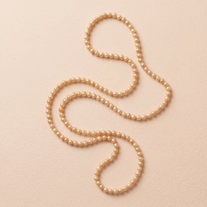 Guirnalda de pearl string doradas