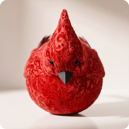 Cardinal rojo de terciopelo con plumas