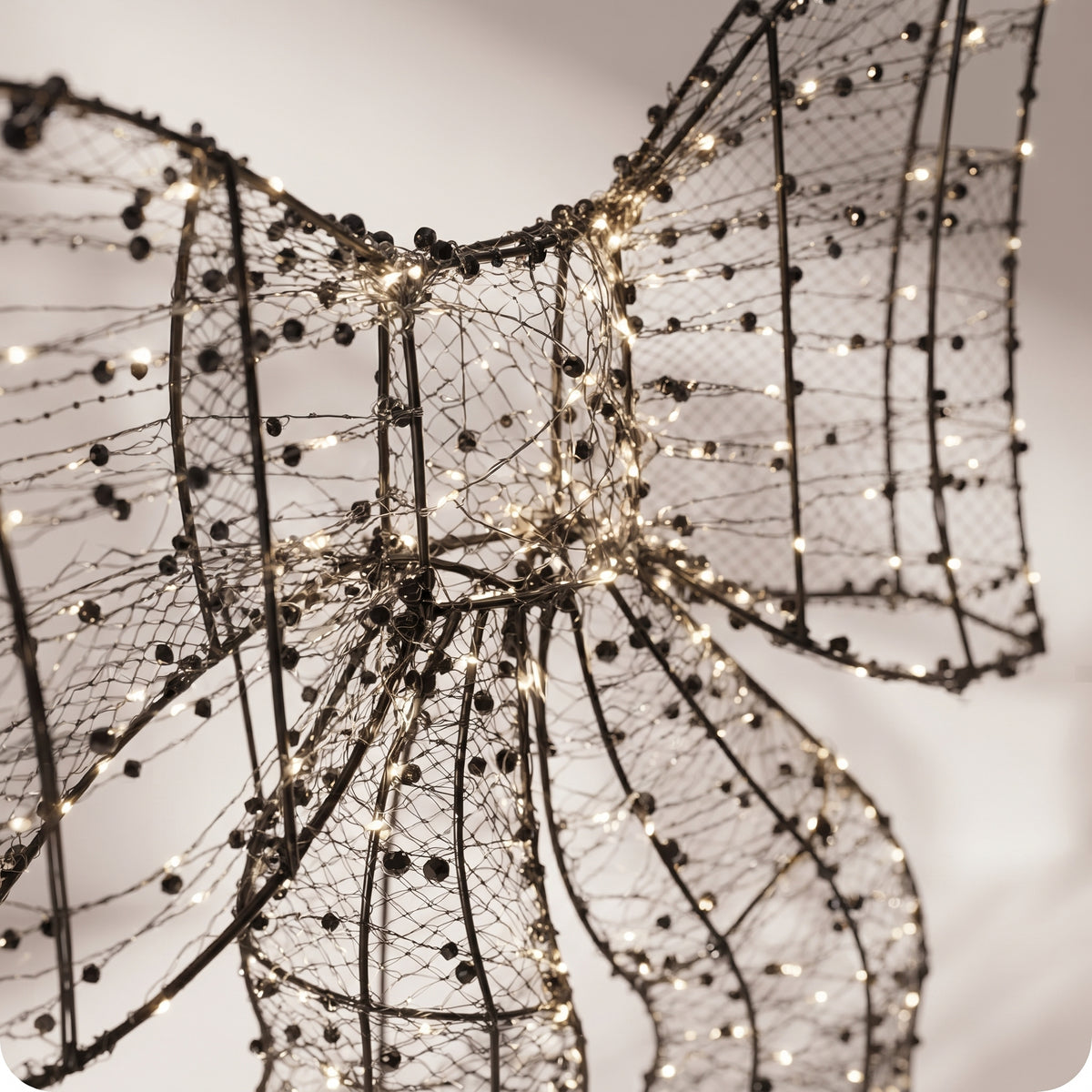 Moño de luz LED con perlas decorativas
